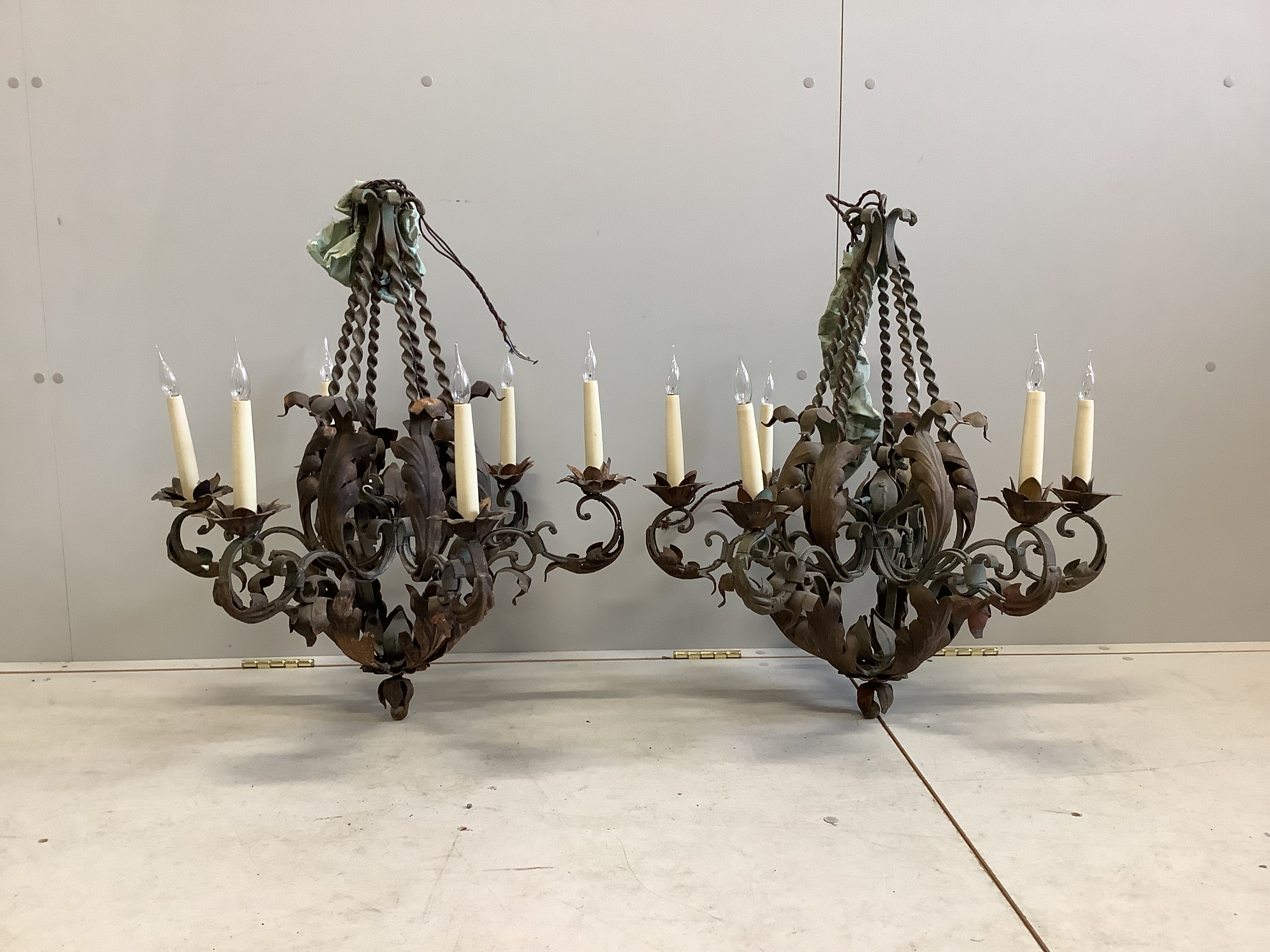 A pair of gilt metal and wrought iron six branch electroliers, height 70cm
